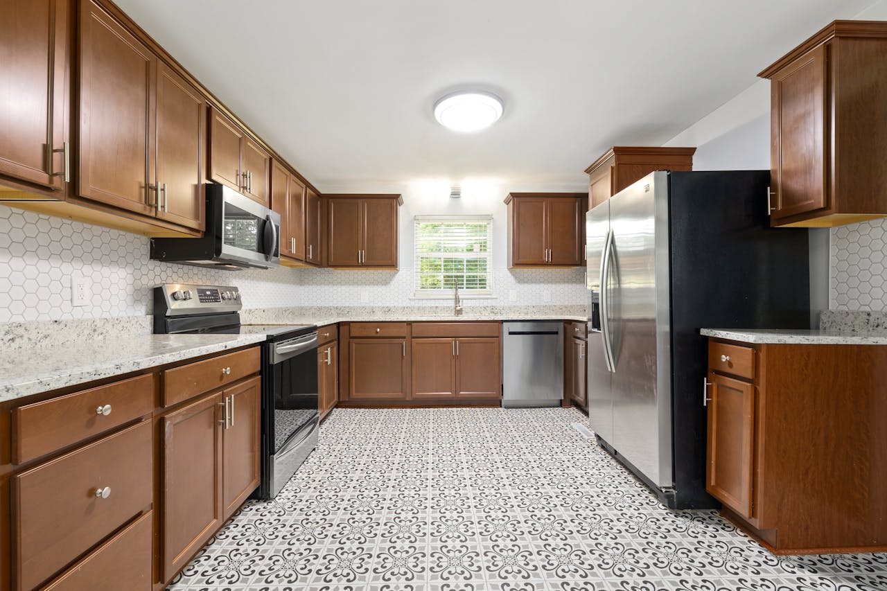 Small kitchen with large-format light-colored floor tiles